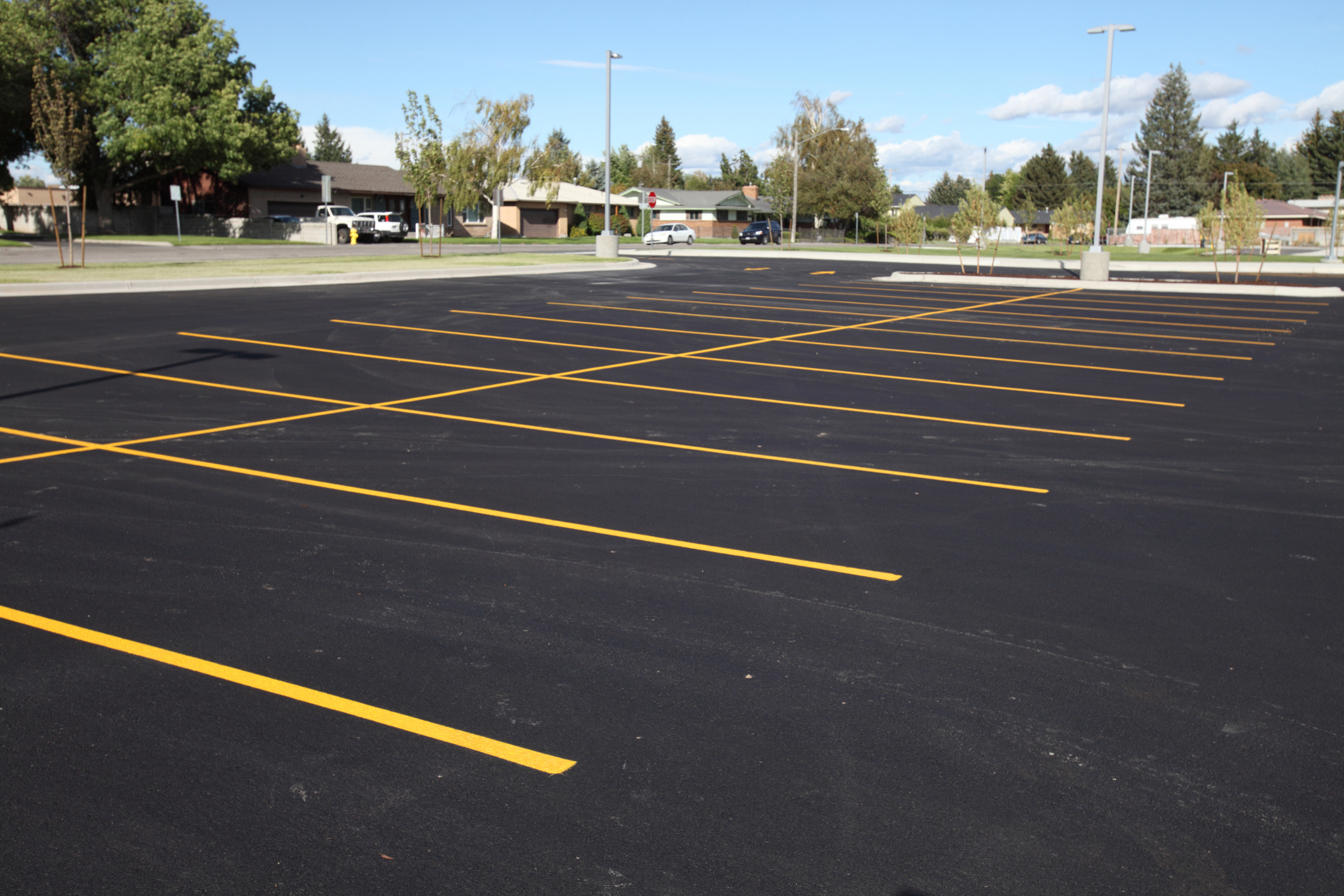 Precise, professional striping like the finished job shown here is just a phone call away with Benson Asphalt Maintenance.